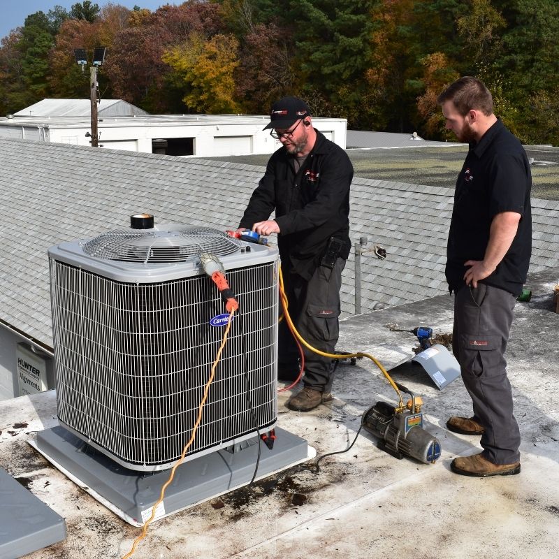 CPS team working hvac unit on commercial roof1 The CPS HVAC services team tests refrigerant levels on a small commercial HVAC system on a rooftop on the Eastern Shore of Maryland.