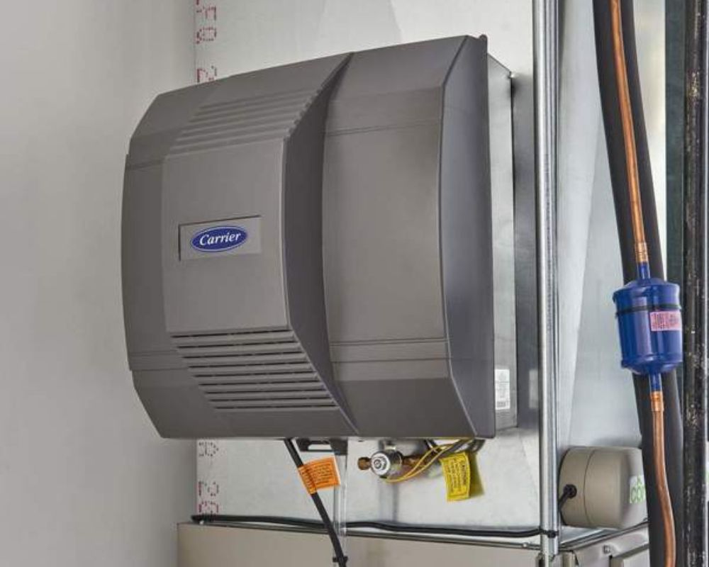 Carrier brand humidifier A Carrier brand humidifier inside a Delaware home's utility room, installed by Comfort Plus Services.