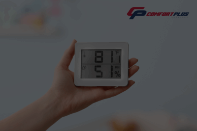 A CPS customer checks indoor humidity levels using a hand-held digital hygrometer, showing 51% indoor humidity.
