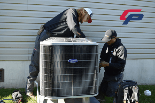 Comfort Plus HVAC technicians conduct a full HVAC system inspection during a seasonal maintenance service call.