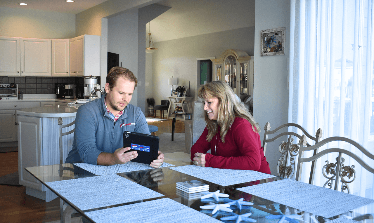 Thorough and Helpful A Comfort Plus Services technician provides a Rehoboth Beach homeowner with a customized in-home estimate and explains what is included.