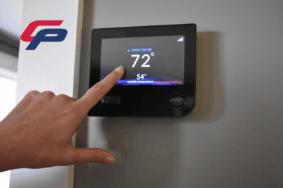 Testing a wi-fi thermostat and heating function during a Comfort Plus Services complete HVAC system and furnace inspection.