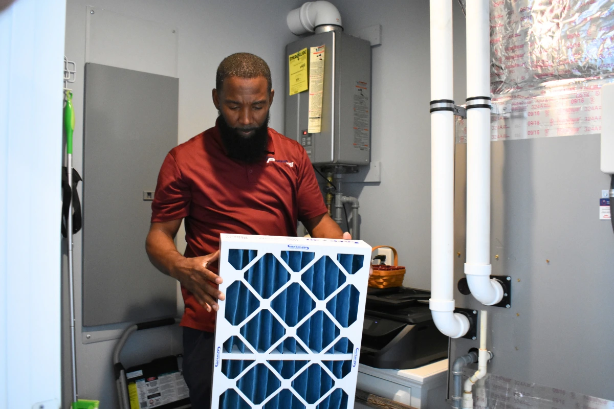 Replacing a MERV-rated air filter during a spring HVAC maintenance visit in Georgetown, Delaware