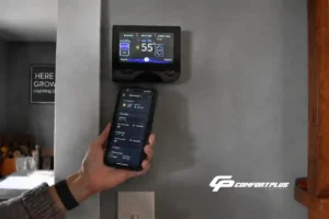 Image of a Delmarva homeowner setting heating at 55 degrees using a wi-fi thermostat and smartphone app.
